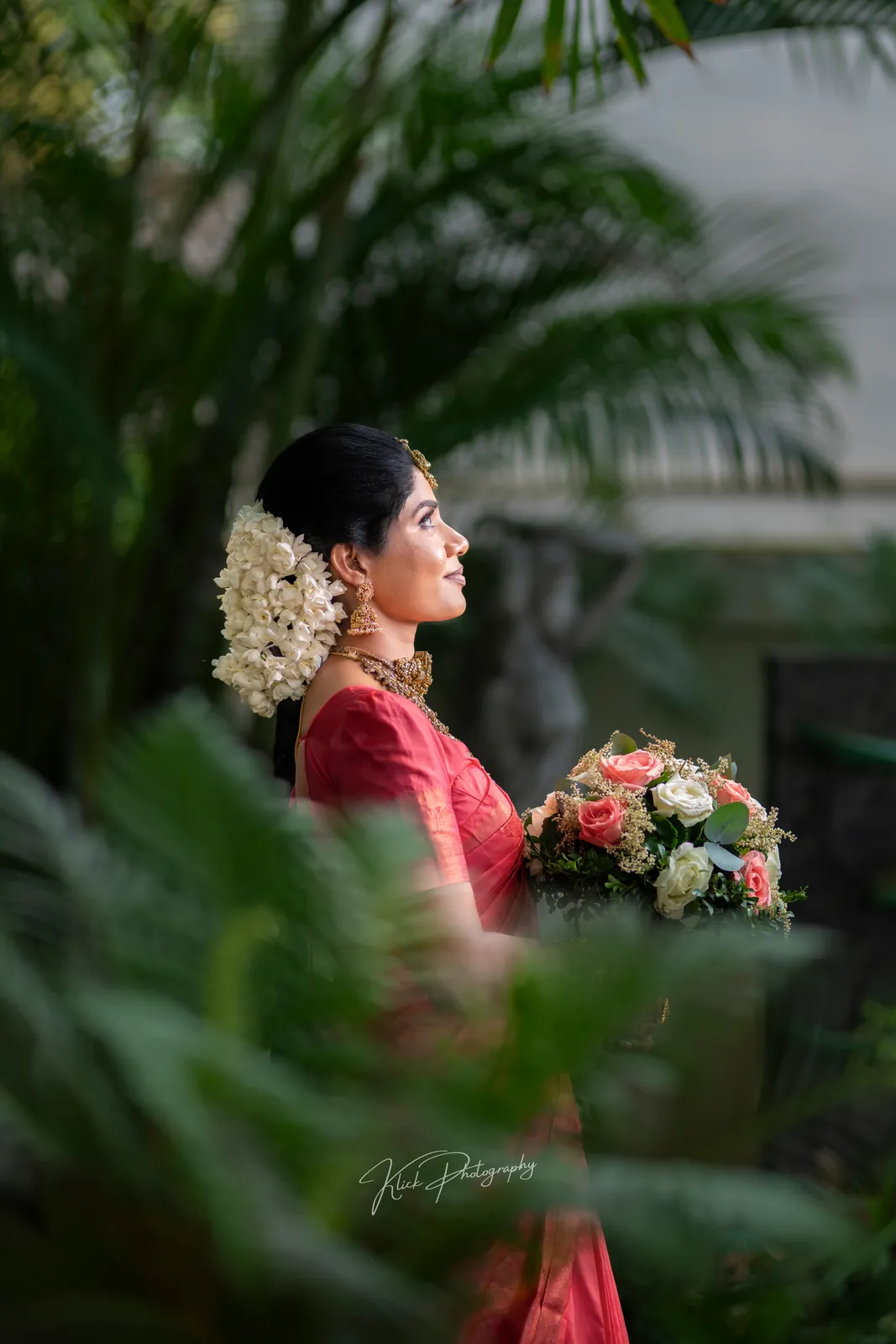 Profile portrait of a bride with jasmine in her hair