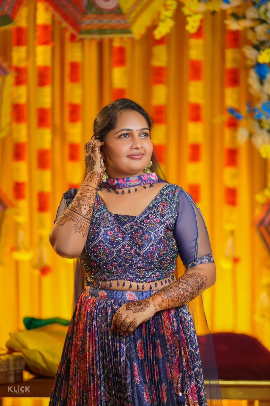 Portrait in festive dress against a vivid backdrop