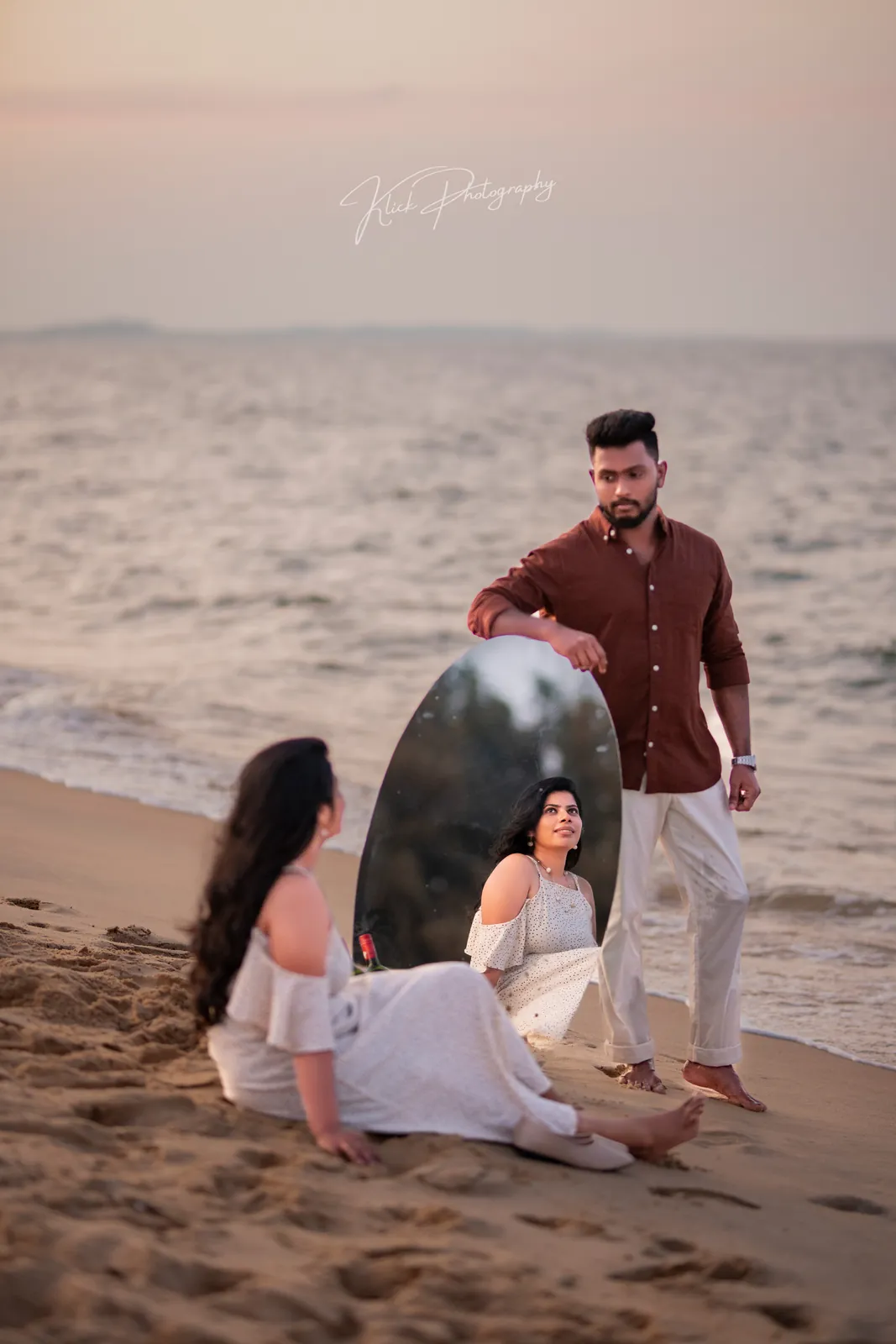 Couple on the beach at sunset