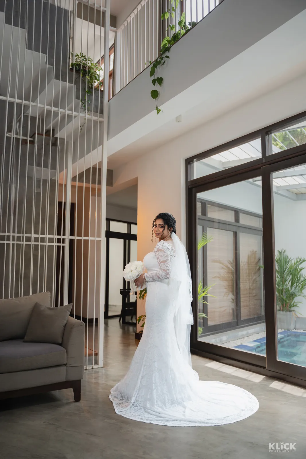 Bride in a white gown photographed in a modern villa in Batticaloa